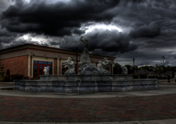 storm clouds over unique fountain