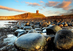 dunstanburgh castle on english rocky shore