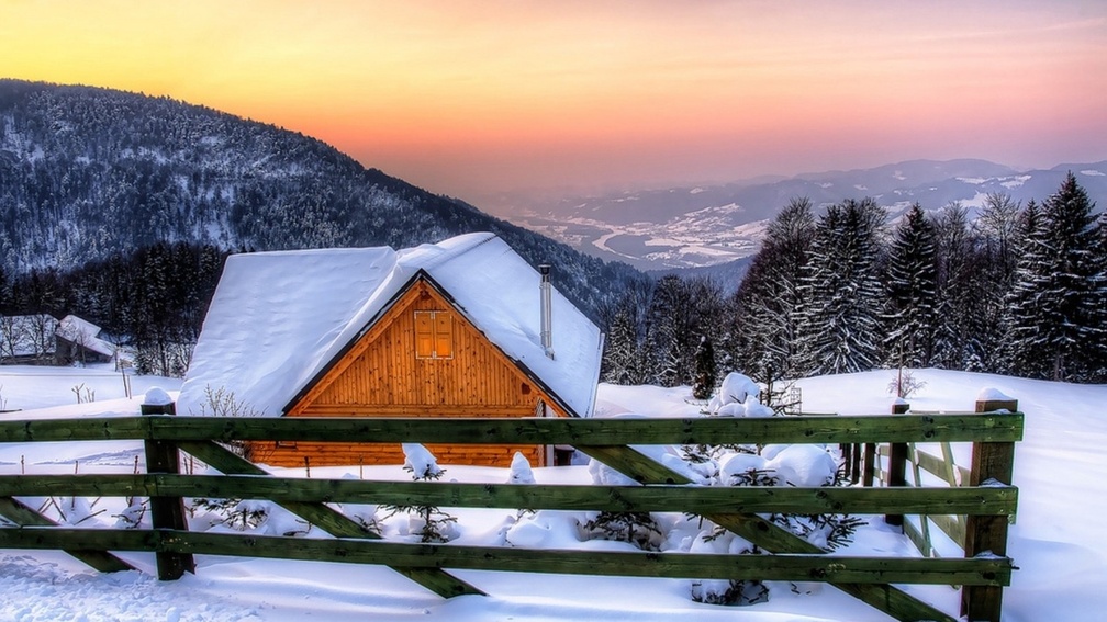 beautiful wooden mountain cabin in winter