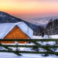beautiful wooden mountain cabin in winter