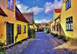 lovely yellow house in a denmark town hdr