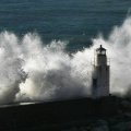 stormy sea wave smashing into lighthouse