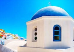 blue church dome in satorini greece