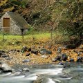 lovely stone cabin by a flowing river