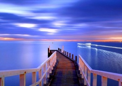 pier on a calm sea at dusk