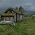 wooden house in misty highlands