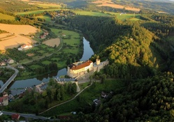 birdseye view of castle along a river