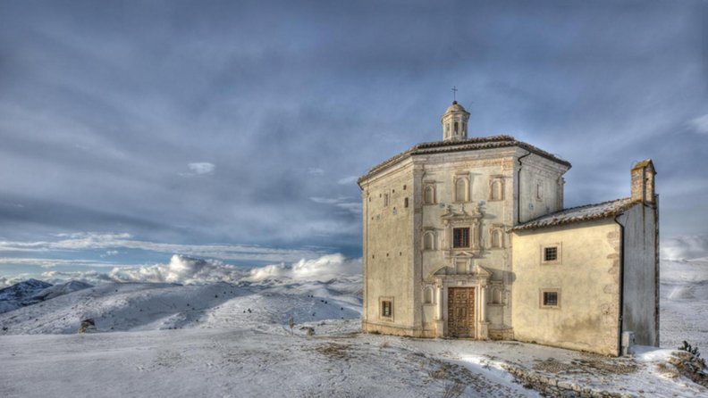 old church on a snowy mountaintop hdr