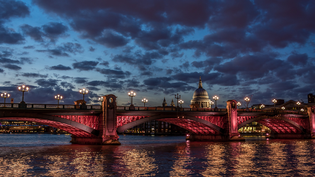 bridge in red lights over the thames