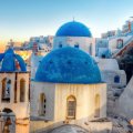 blue domes on a church in a greek town