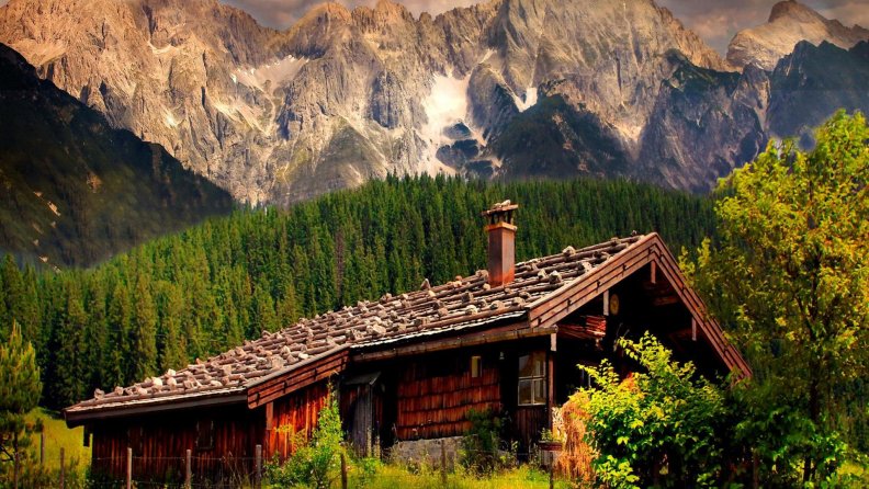 wooden cabin under majestic austrian mountains