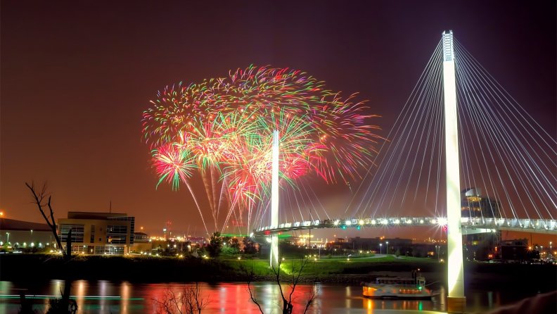 fireworks_over_modern_pedestrian_bridge.jpg