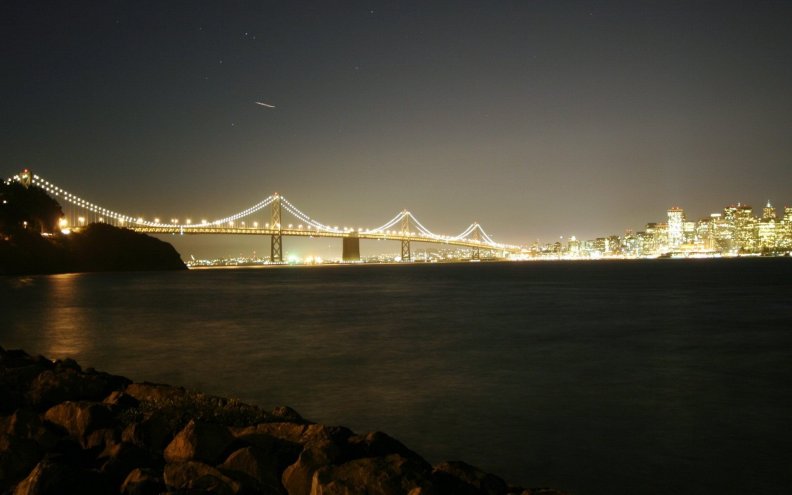 san_francisco_bay_bridge_lit_up_at_night.jpg