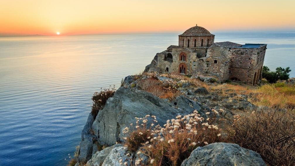 church ruins on a greek isle at sunset