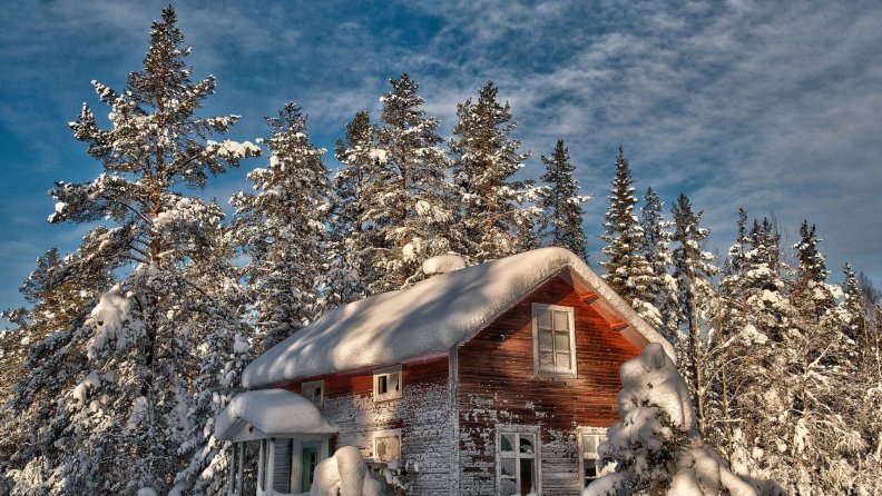 gorgeous wooden forest home in winter hdr