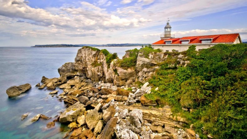 lighthouse on a rocky shore hdr