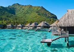 fantastic bungalows on stilts in a lagoon