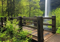 bridge by a waterfall