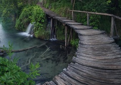 wonderful wooden bridge over a river falls