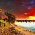 bungalows resort on moorea on a wondrous sunset