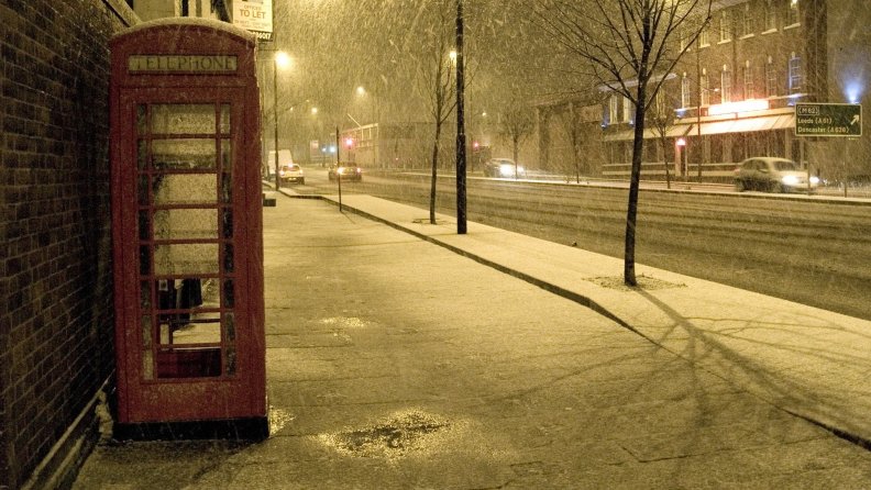 phone_booth_on_a_british_sidewalk_in_a_snow_shower.jpg