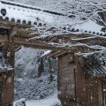 gate to a mountain temple in japan in winter