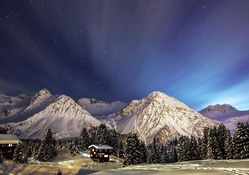 mountain cabins in winter at night