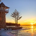 lake lighthouse in a winter sunset