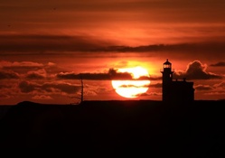 cape arago lighthouse in spectacular sunset
