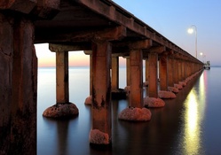 cement pillared pier in a calm sea