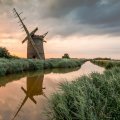 old windmill along a canal