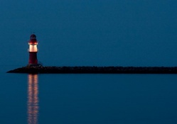 fantastic lighthouse lit at night
