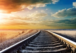 train tracks to the setting sun