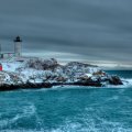 lighthouse on a cape in winter