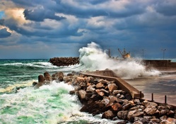 waves smashing on a rocky sea breaker hdr