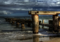 old broken dock on a beach hdr