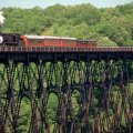 train on a metal bridge over a gorge