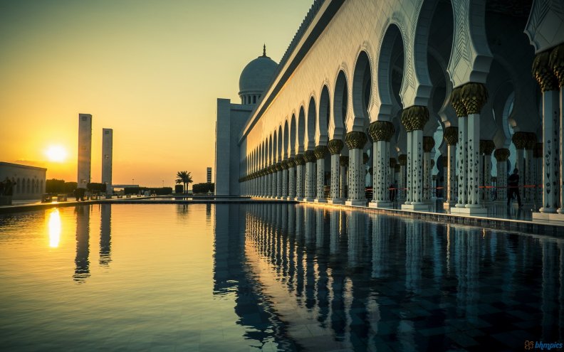 the grand mosque in abu dhabi at sunset