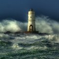 awesome lighthouse in a rough sea
