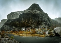 huts inside a mountain cavern