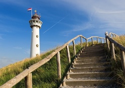 steps to a tall lighthouse in holland