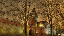 a fortress in poland on a winter night