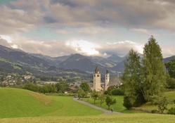church in a meadow of a valley town