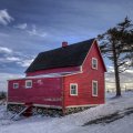 wonderful red farmhouse in winter