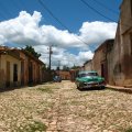 old cars on a street in a cuban town