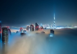 fantastic skyscrapers through the fog in dubai