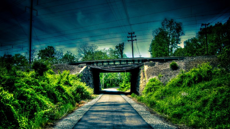 railway bridge over lonely road hdr