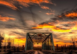 metal bridge under a gorgeous sunset hdr