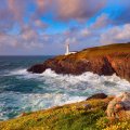 beautiful lighthouse over a rugged seashore
