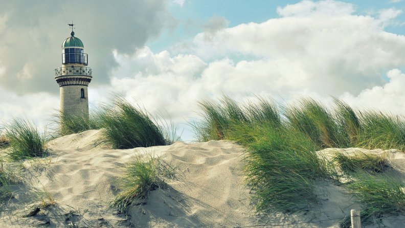 gorgeous lighthouse in sand dunes